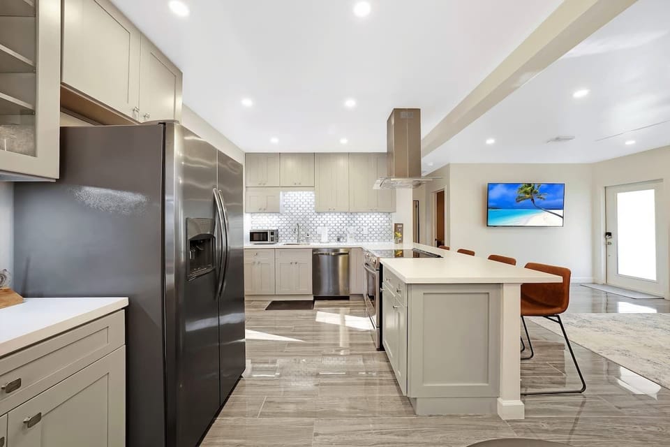 kitchen is equipped with coffee maker, basic cookware and silverware