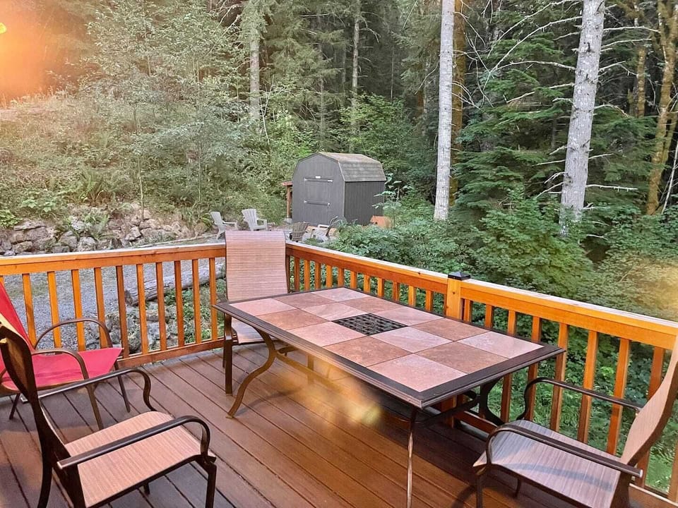 Dining table on back deck with seating for five