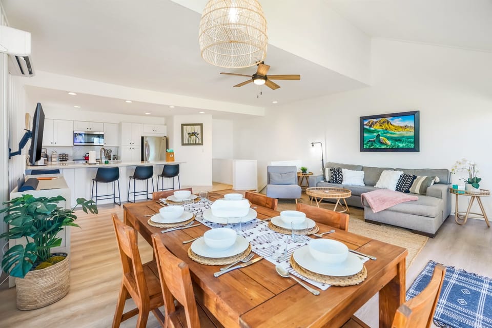 Open and airy living, dining, kitchen area with tall ceilings