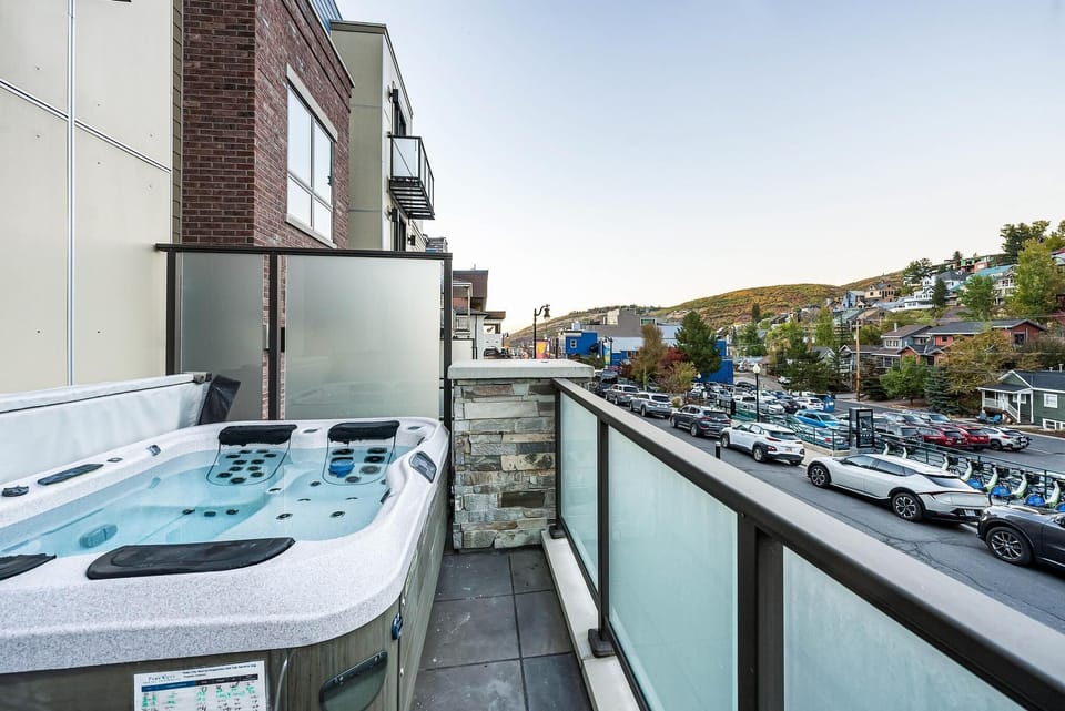 Town/mountain facing balcony w/ private  hot tub with access through the foyer.