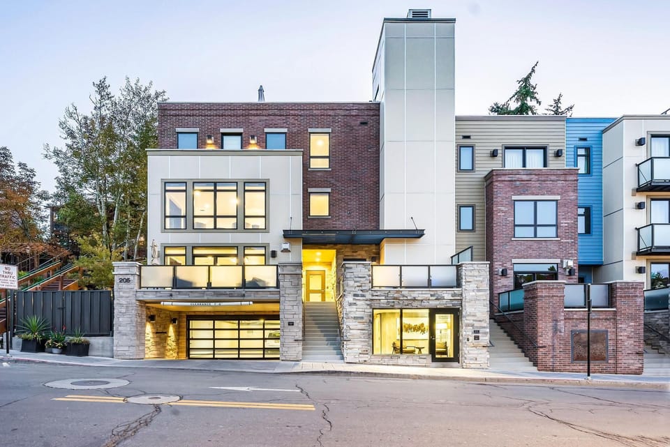 Exterior photo of condo, entrance from Main St. and community garage entrance.