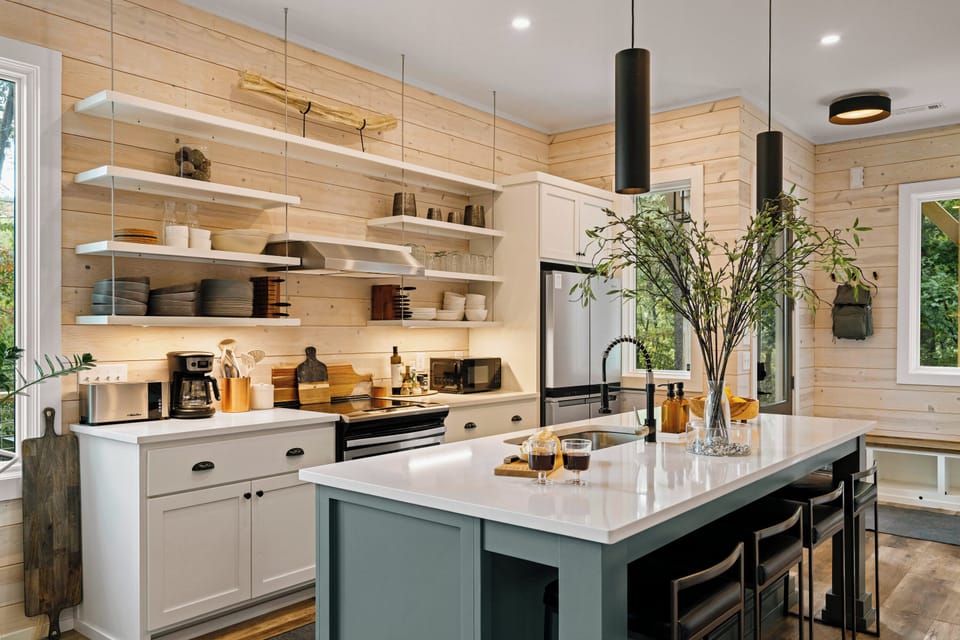 Light filled kitchen combines modern style with rustic warmth. 