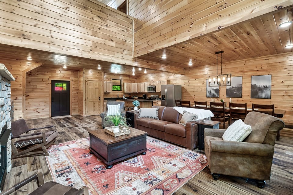 Two story living room open to the dining area.