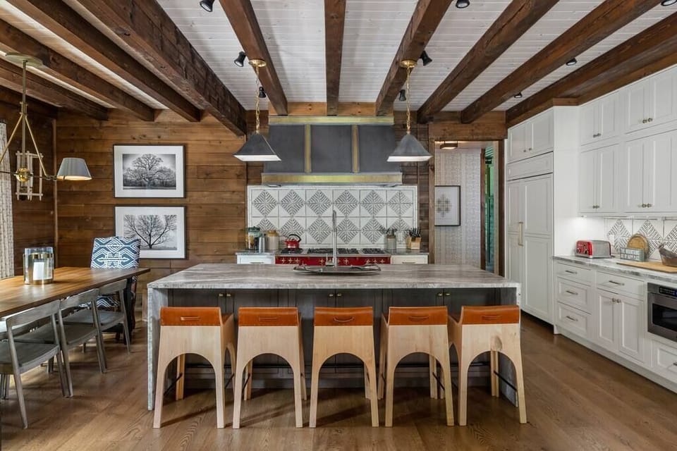 Stylish kitchen with oversized island and dining area.