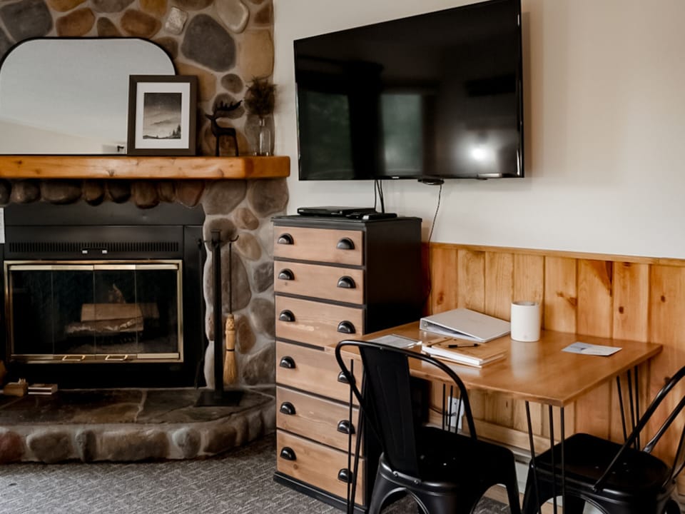 Enjoy a real fire, satellite TV, or play a game at the hand-crafted dining table