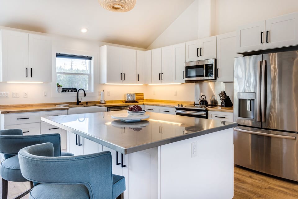 Keep the cook company at the spacious island and bar stools.