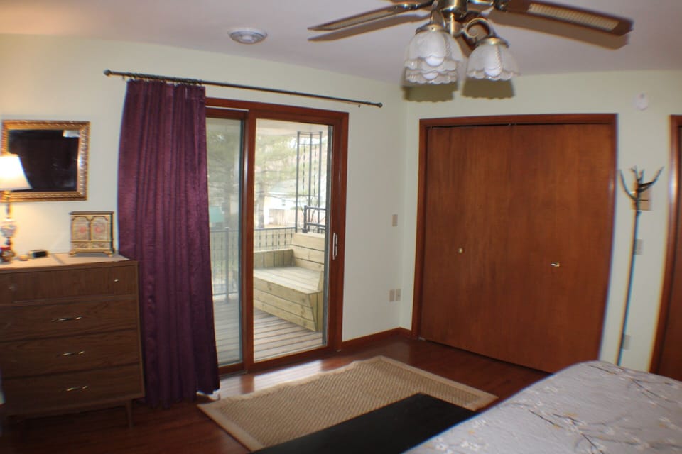Primary bedroom private balcony overlooking the heated pool 