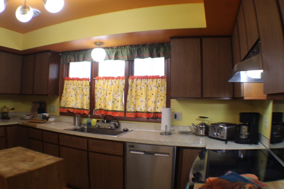 Kitchen well stocked with small appliances and kitchen necessities