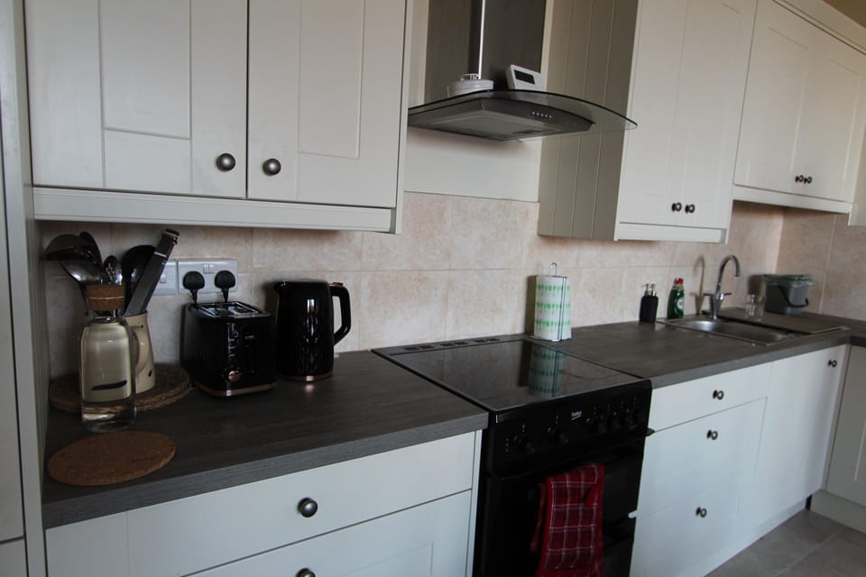 Kitchen is packed with a Refrigerator, Oven, Stove, Dishwasher, Microwave ect