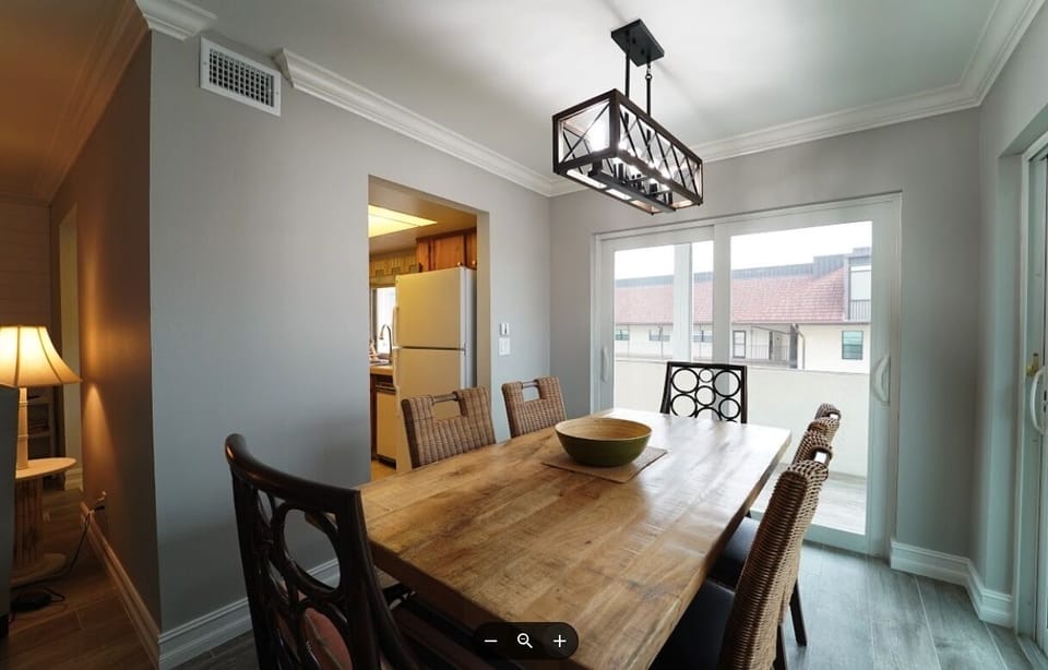 Dining area with new Table and chairs overlooking lanai.  