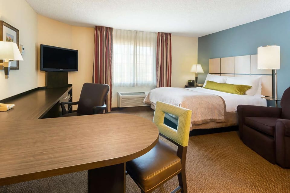 Unwind in a bright, spacious room with cozy seating.