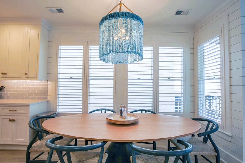 The dining table seats six.  There are three stools at the kitchen island and an outdoor dining table on the back porch.