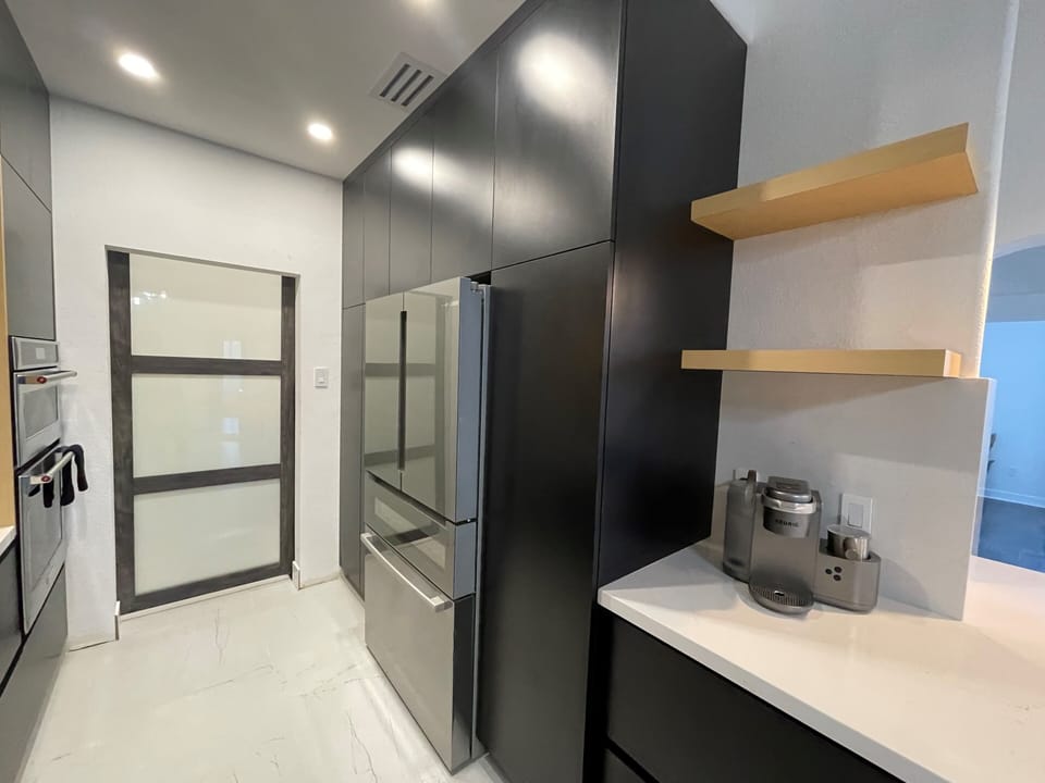 European style kitchen with high-end Bosch and KitchenAid appliances and Keurug