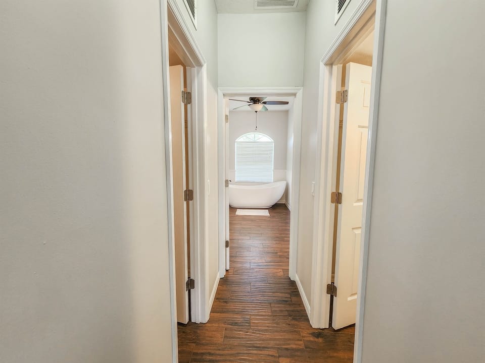 Enjoy the his and hers closets in the master