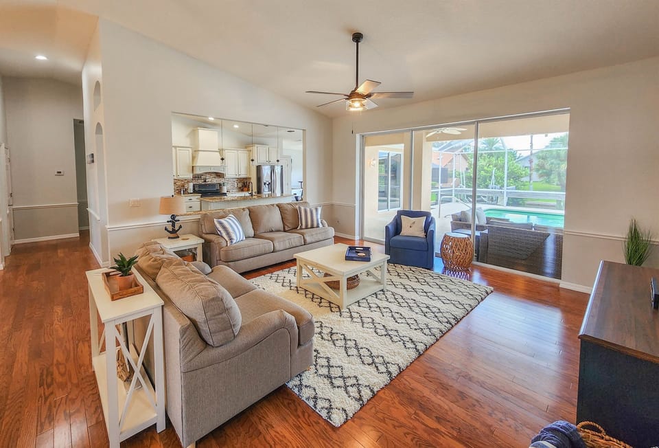 Relax in the spacious living area on the plush, inviting sofas