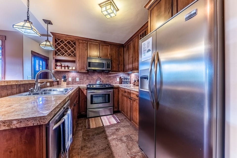 Kitchen - Offers a variety of kitchen utensils, a crock pot, coffee maker, and toaster,