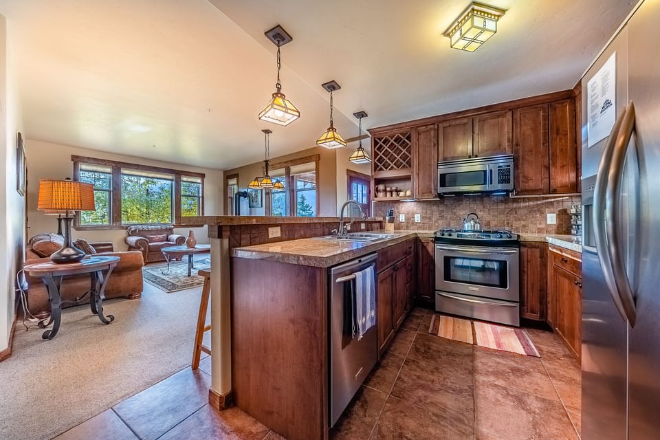 Kitchen - Full size stainless steel appliances and granite counters.