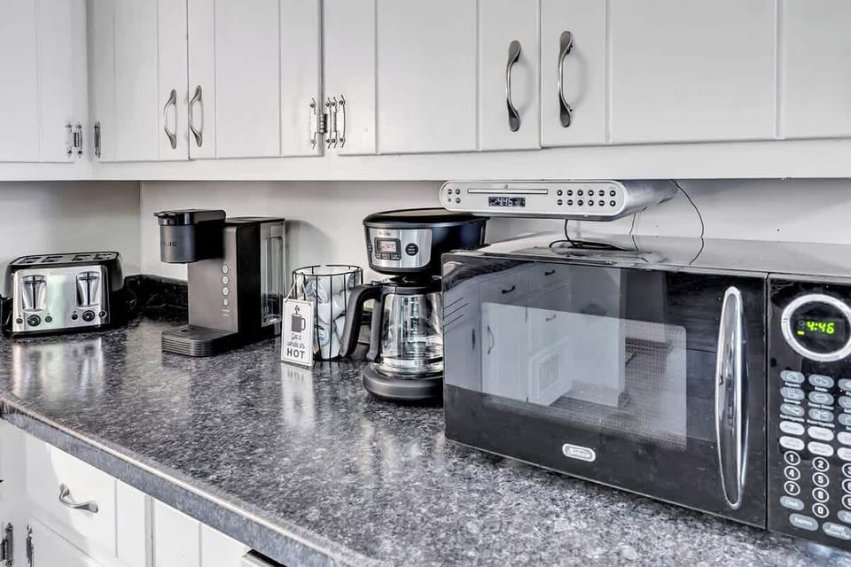 Tabletop appliances for your convenience: microwave, toaster, coffee maker