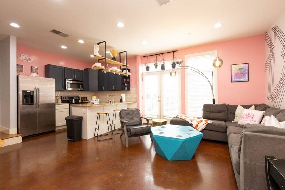 Open-concept space with fun pink vibes—perfect for your Nashville getaway