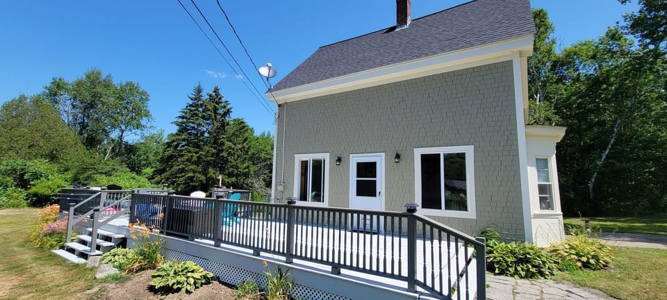 Large deck with entrance into the Kitchen. 