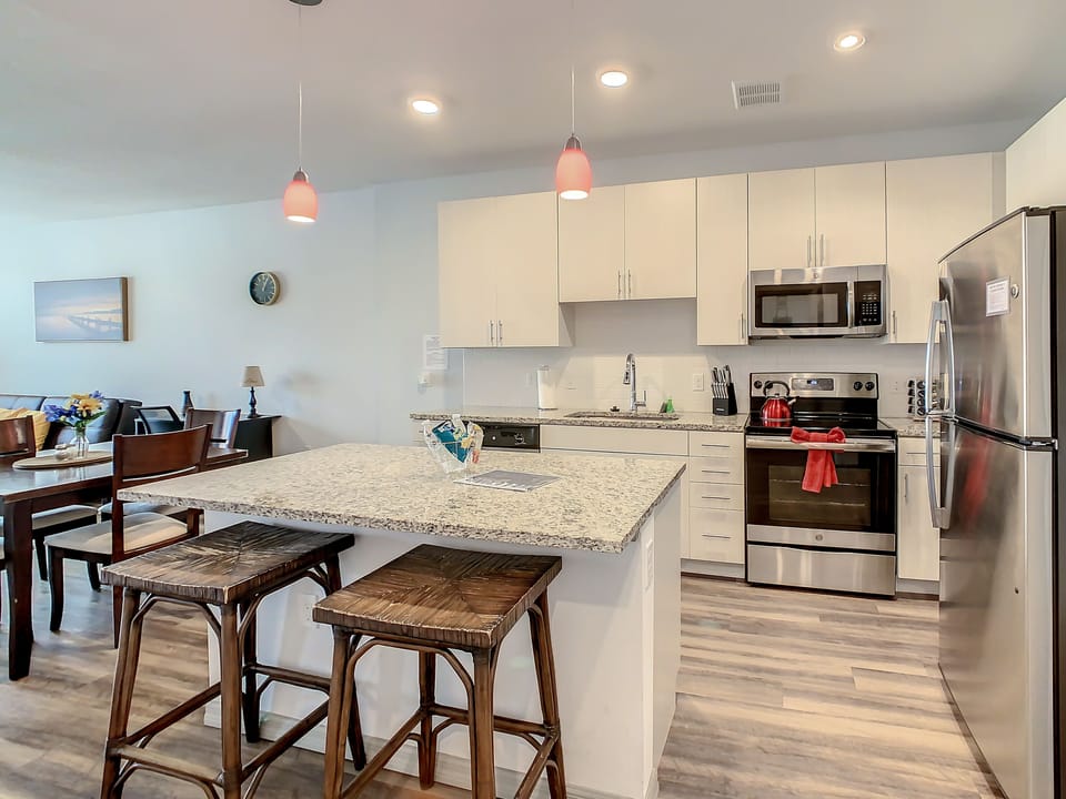 Modern and sleek kitchen, perfect for culinary adventures, during your stay.