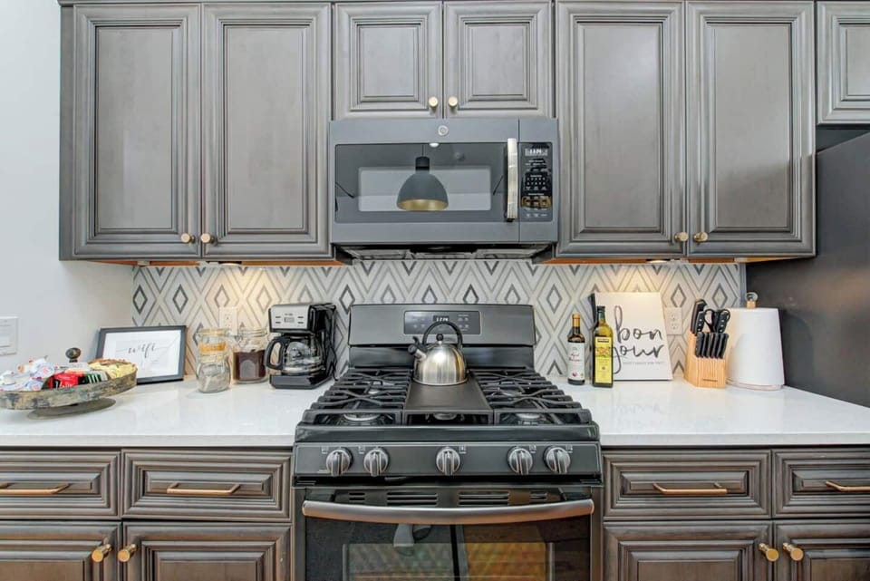 Use clean, new GE appliances to prepare meals for your group.  Large appliances include microwaves, oven range, French door refrigerator, dishwasher, & garbage disposal.  The upstairs kitchen has a gas oven range and the lower level has electric.