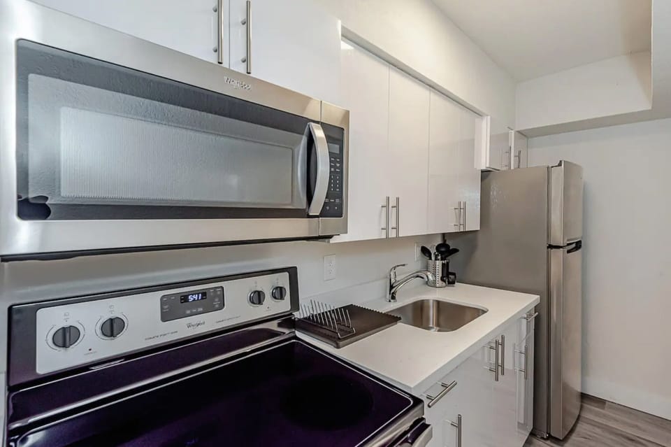 Featuring large kitchen sink and flat cook top