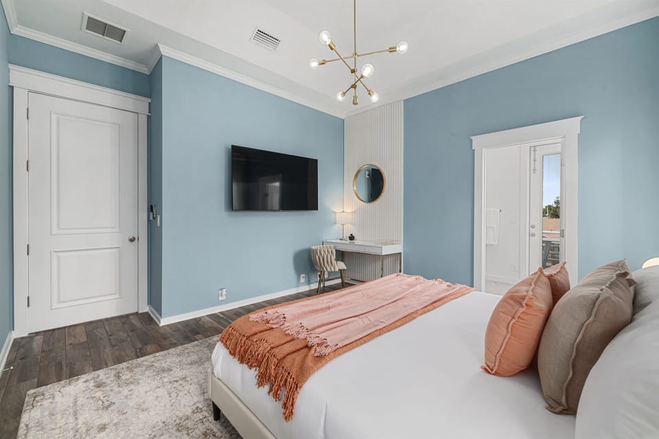 Guest bedroom #4 with king bed, smart TV, work space, and ensuite bathroom