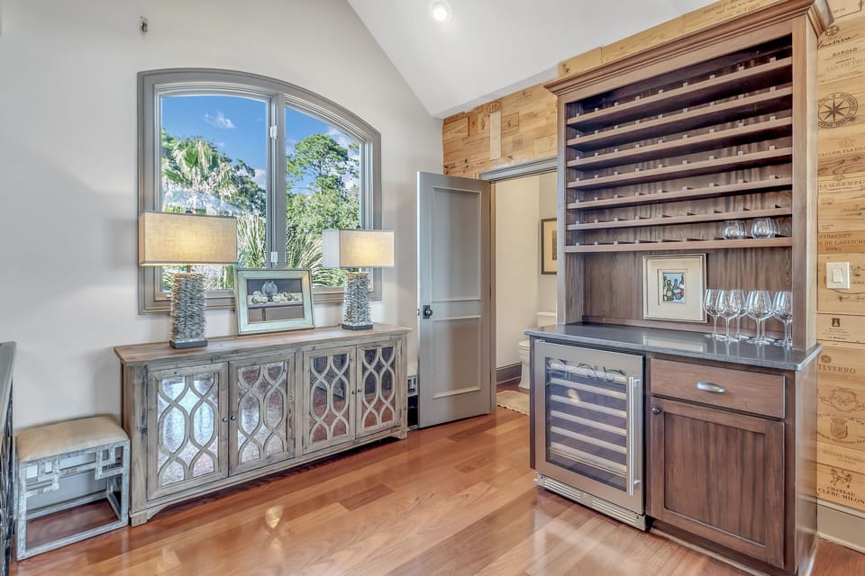 Wine fridge and half bath off of living area.