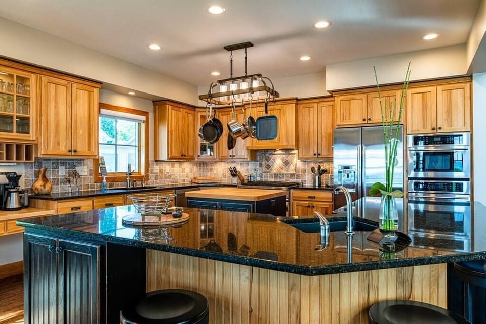 Kitchen with high end fixtures and equipment.
