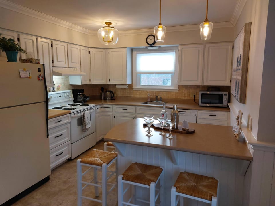 Open kitchen with counter stools.