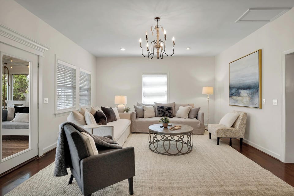 This beautiful living space leads to our large indoor back porch