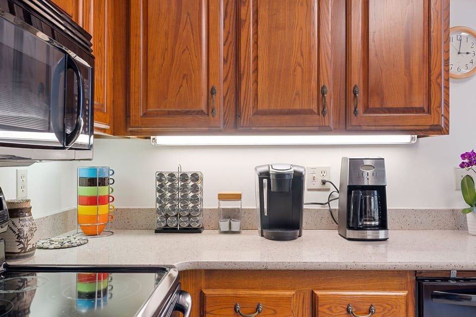 Plenty of cookware, appliances and many spices