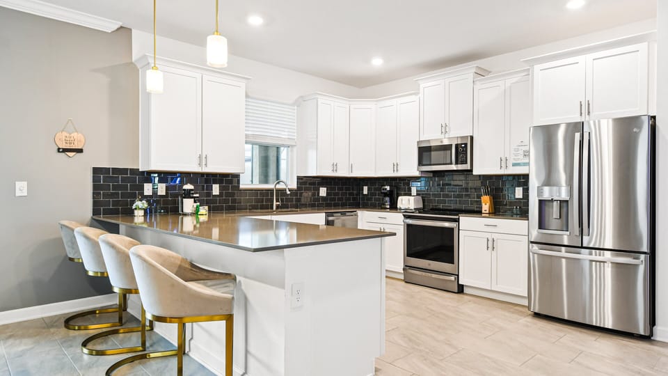 Sit up at the breakfast bar and keep the chef company.