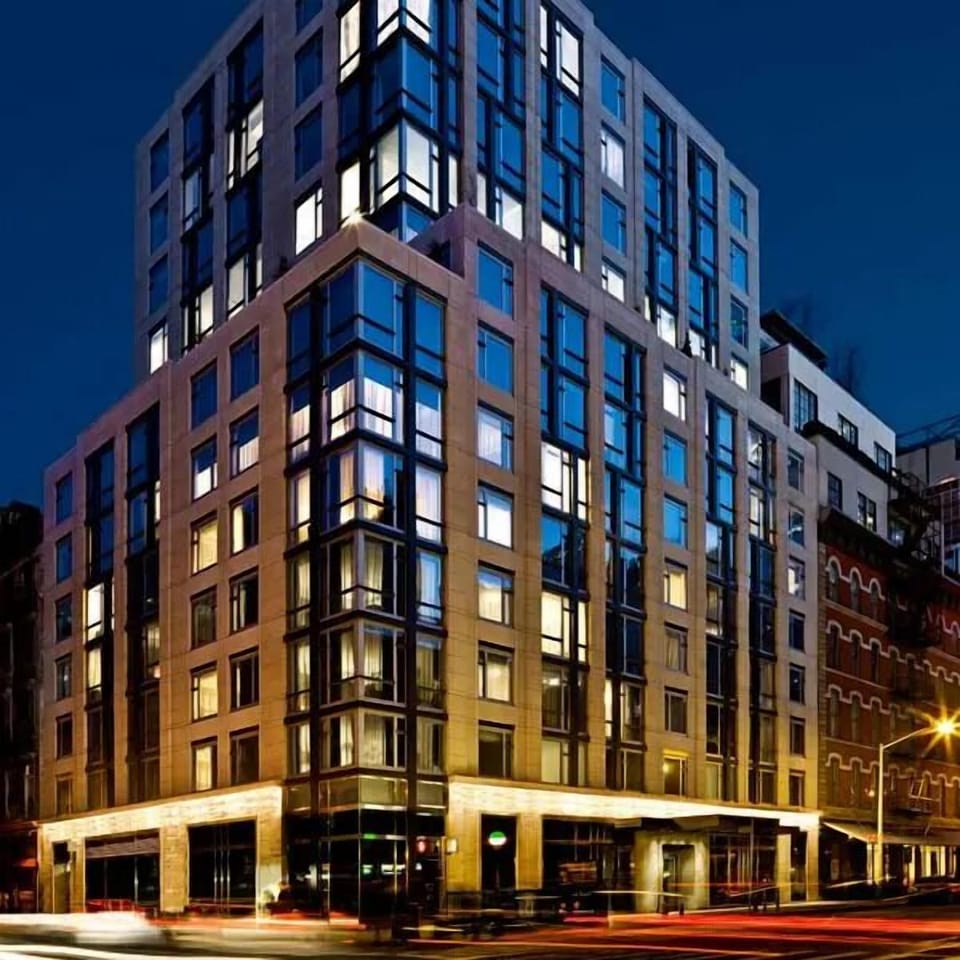 Arrive in style to a sleek, city-lit modern landmark.
