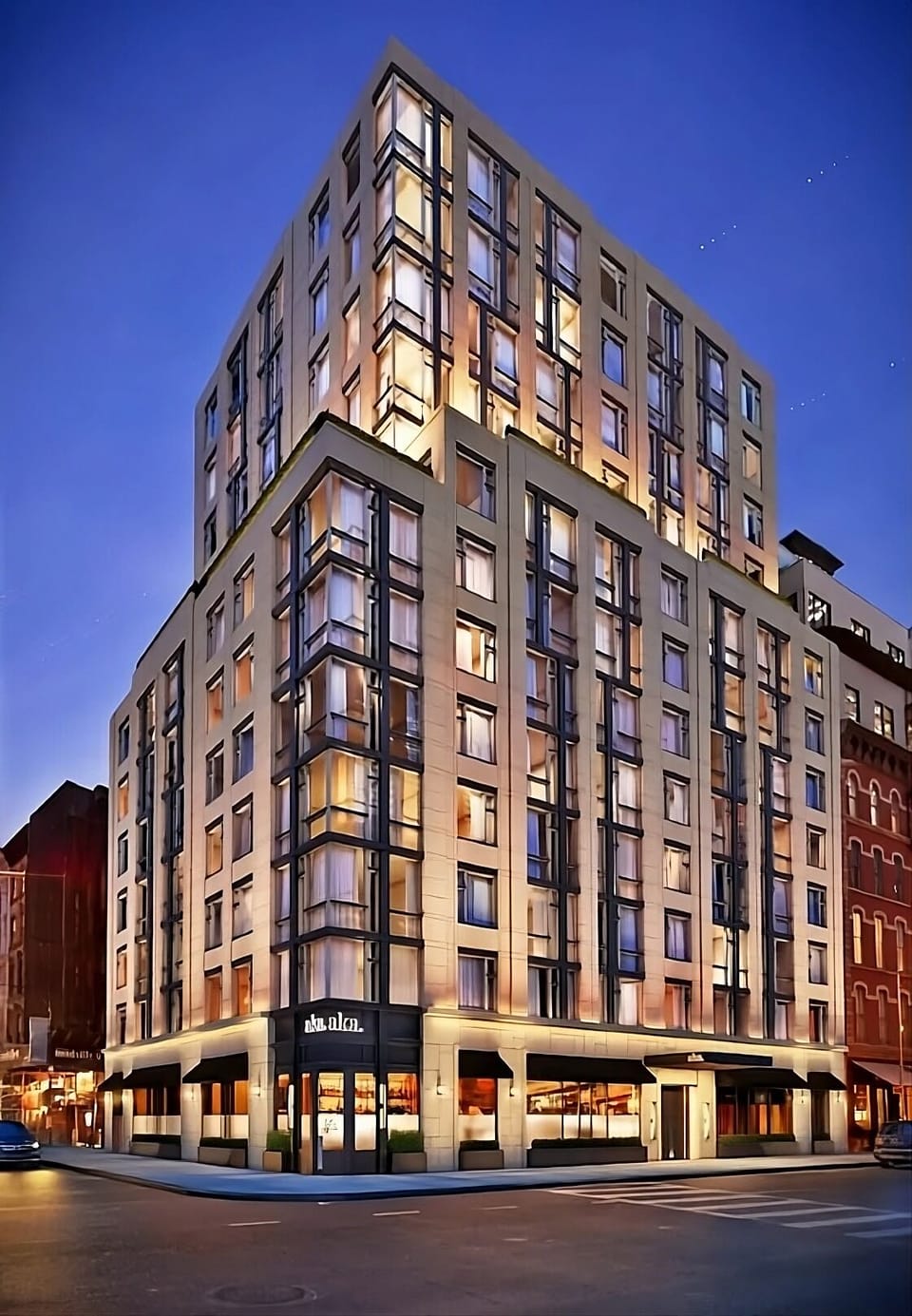 Arrive in style at a modern building glowing at night.