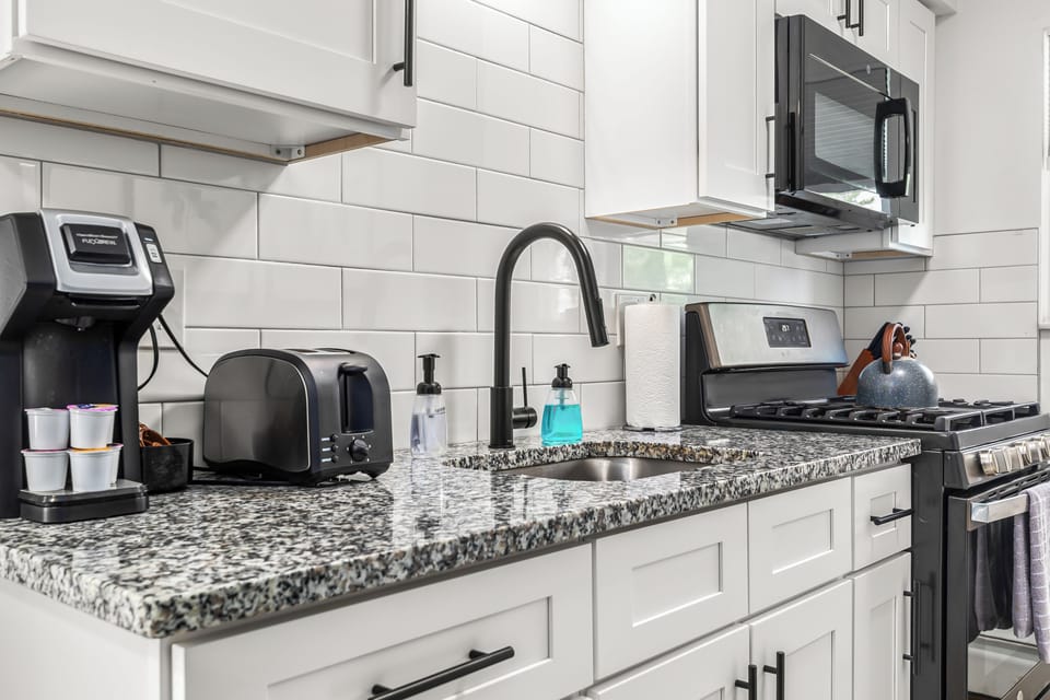 Start your day off right with a delicious breakfast made in this cozy kitchen.