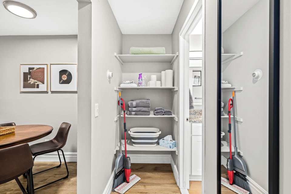 Keep your Airbnb tidy and organized with this spacious walk-in closet. The broom and mop are always within reach, so you can quickly clean up any messes. The perfect place to store your belongings and keep your Airbnb looking its best.