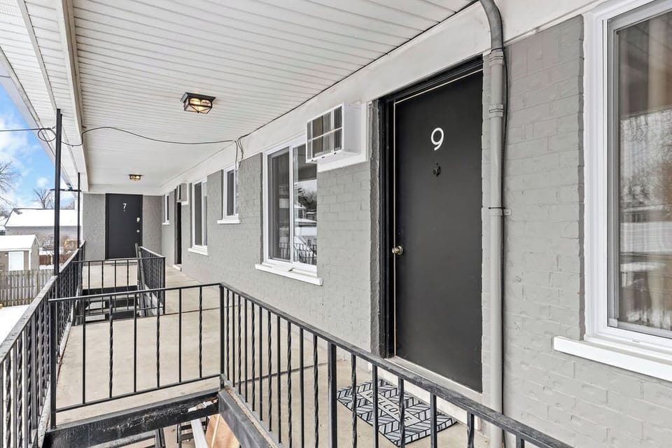 Enjoy the fresh air and stunning views on this balcony.