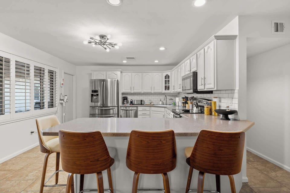 Cozy up at the countertop seating in kitchen.
