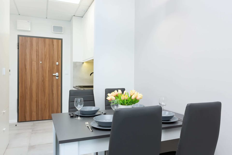 Large table with chairs for eating communal meals. 