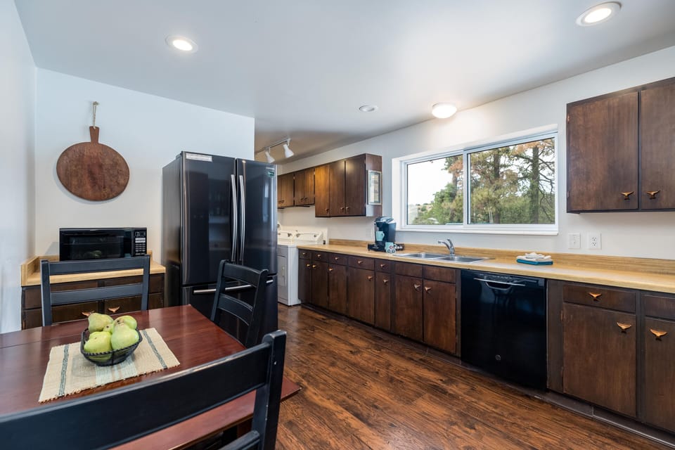 The kitchen is fully equipped with a dishwasher, microwave, blender, toaster, coffee maker, and more, allowing you the freedom to prepare gourmet meals at your leisure.