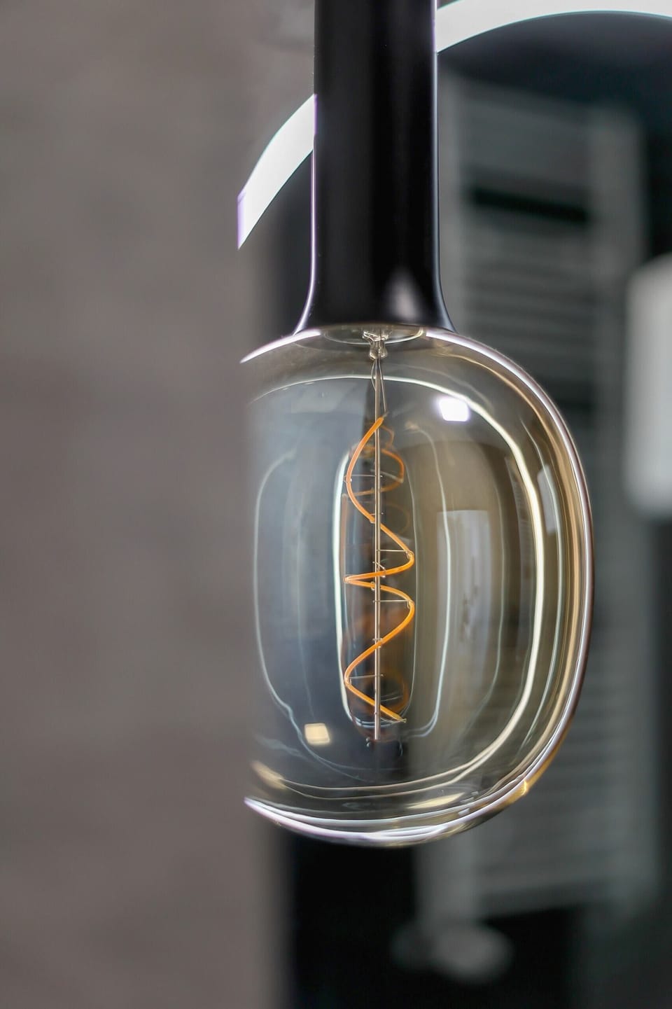 Close-up of a modern light fixture, showcasing an artistic and industrial design.
