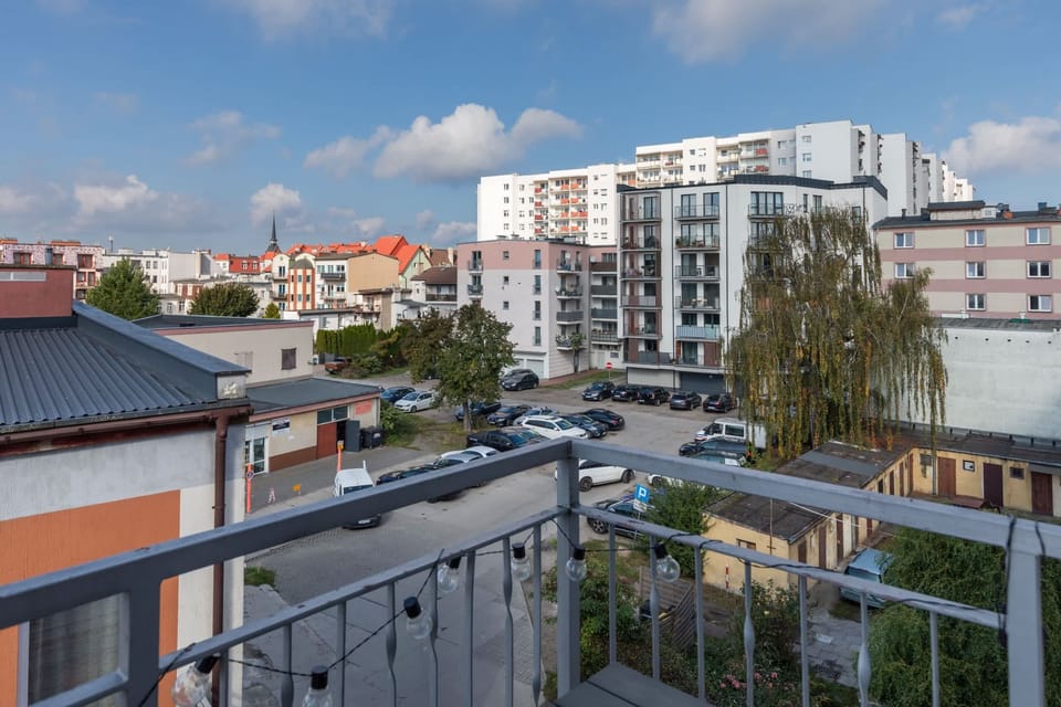 Another balcony shot overlooking a lively harbor scene, ideal for enjoying the outdoors.

