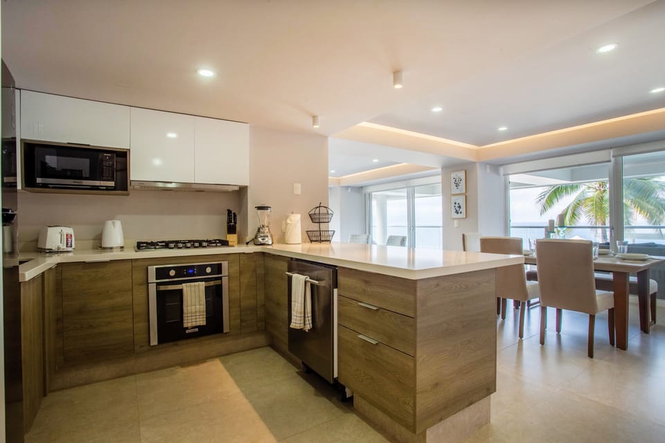 The kitchen has fridge, stove, oven and dishwasher