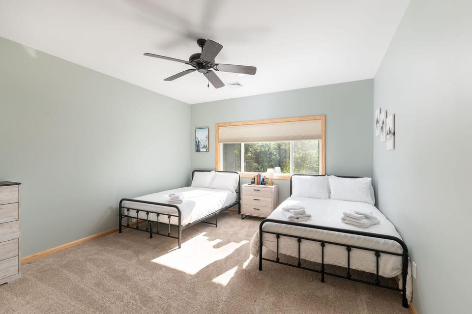 The Forest Room -- two double beds and a full closet.