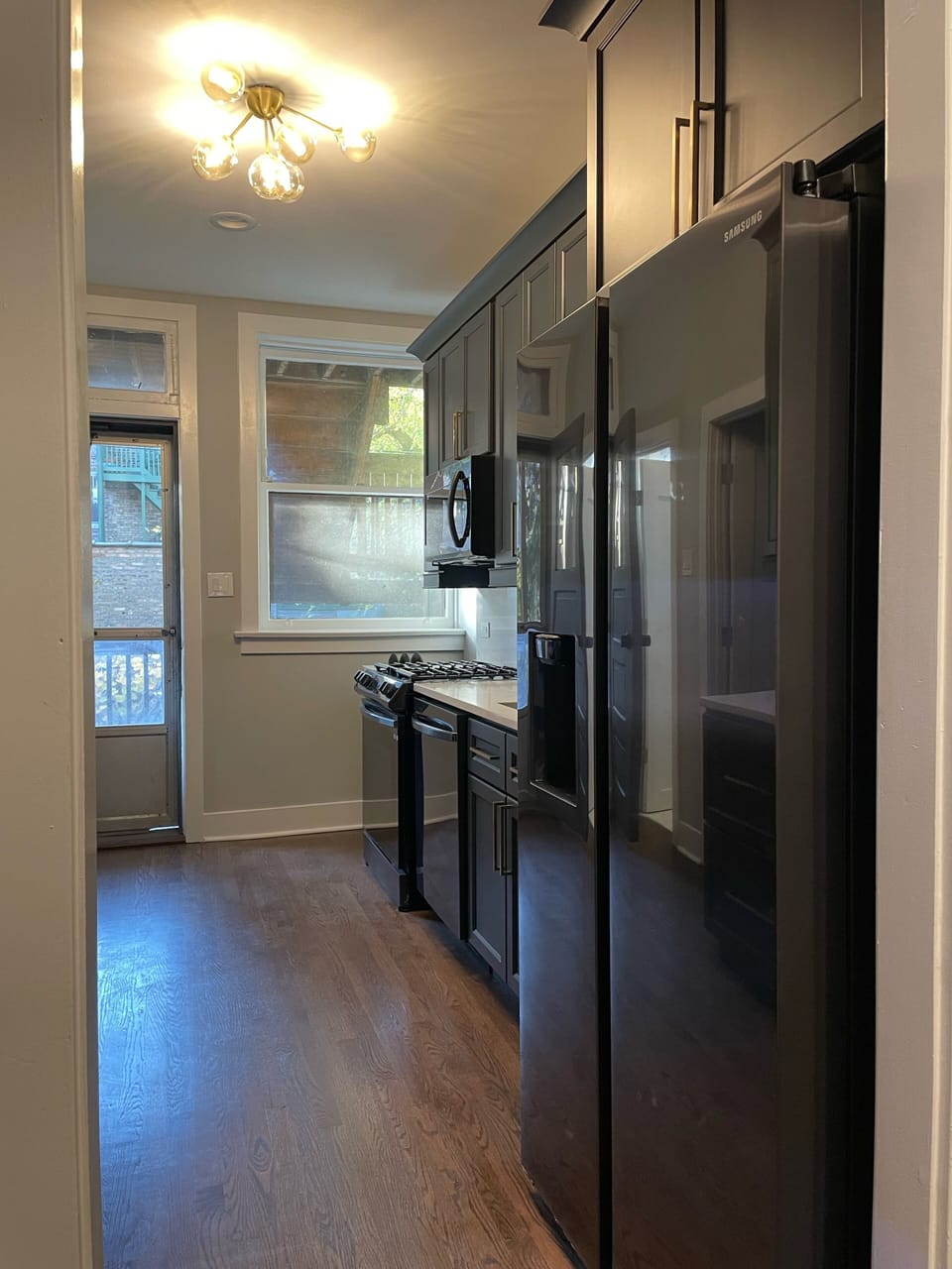 New kitchen has upgraded appliances, new cabinetry and quartz ctops.