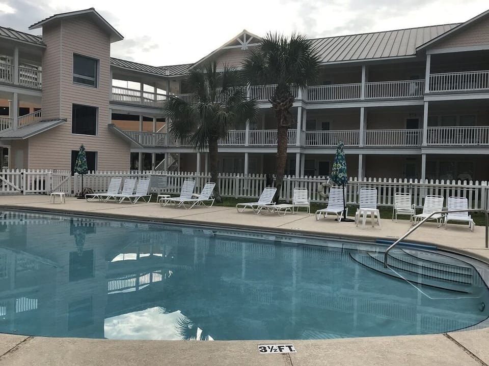 D-301 is third floor corner behind palm trees