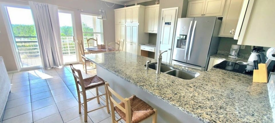 View of kitchen and dining area from hall-the path to the balcony!