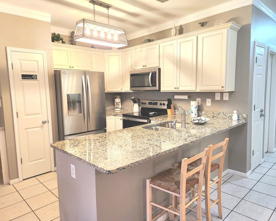 Compact kitchen with lots of supplies.  Check the pantries for extra appliances.